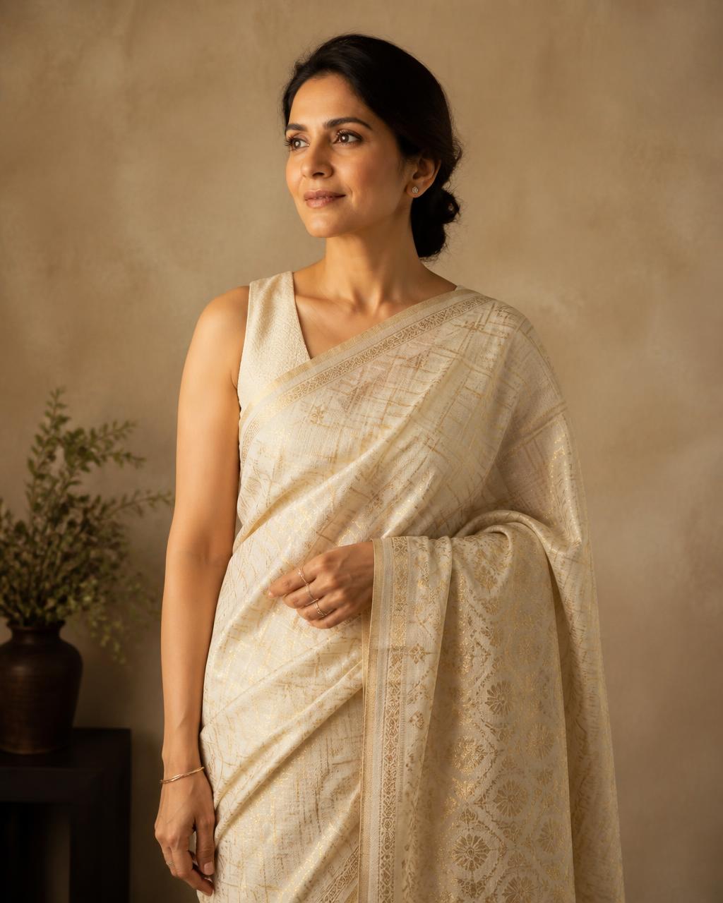 Placeholder editorial portrait of the House of Airaa founder wearing an ivory handwoven sari.
